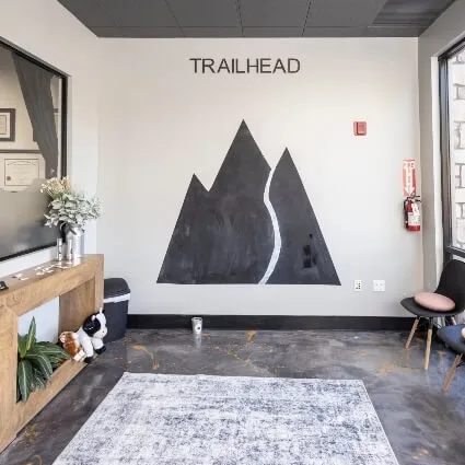 Trailhead Family Chiropractic lobby with mountain wall art and reception area in Murrieta, CA