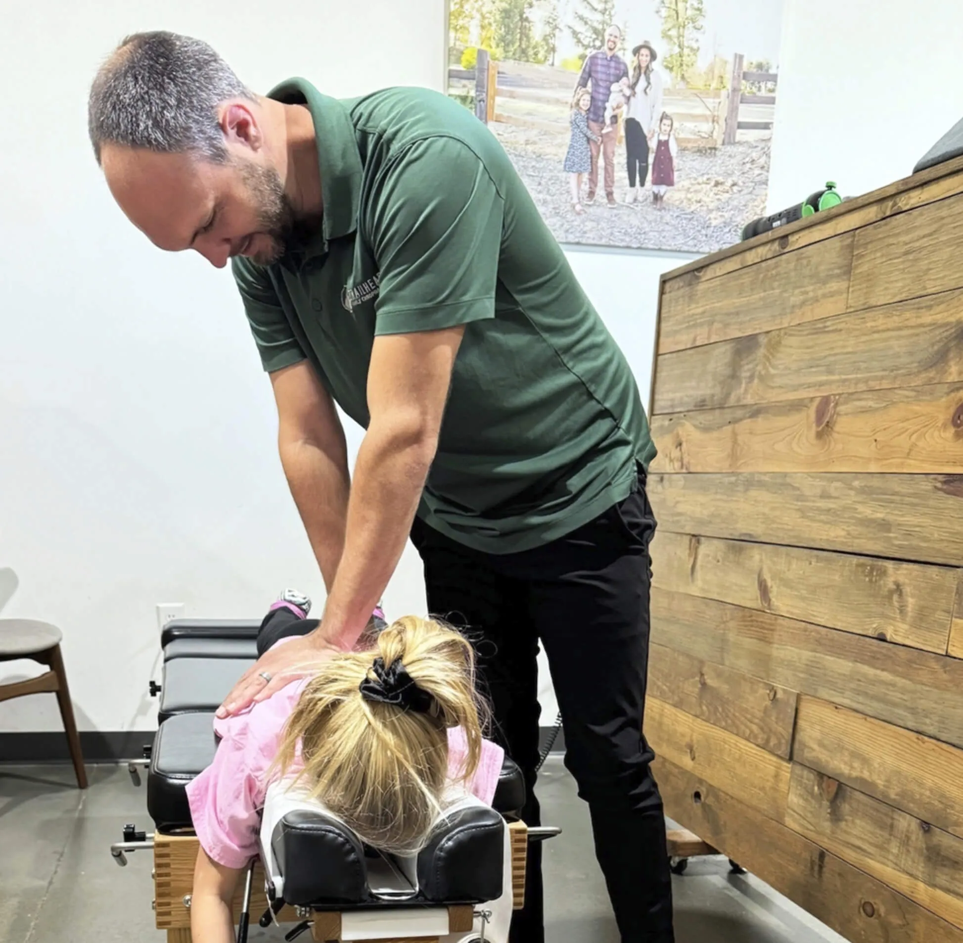 Chiropractor performing a spinal adjustment on a patient at Trailhead Family Chiropractic in Murrieta, CA