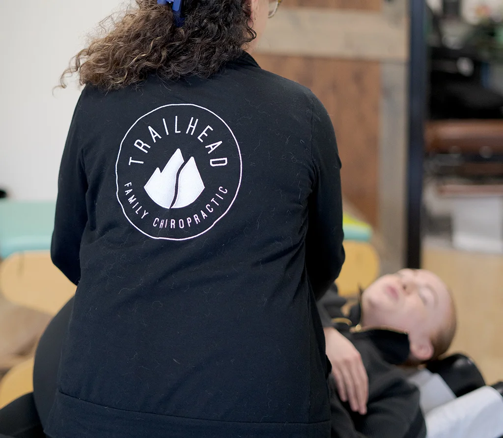 Chiropractor providing spinal care for a patient at Trailhead Family Chiropractic Temecula