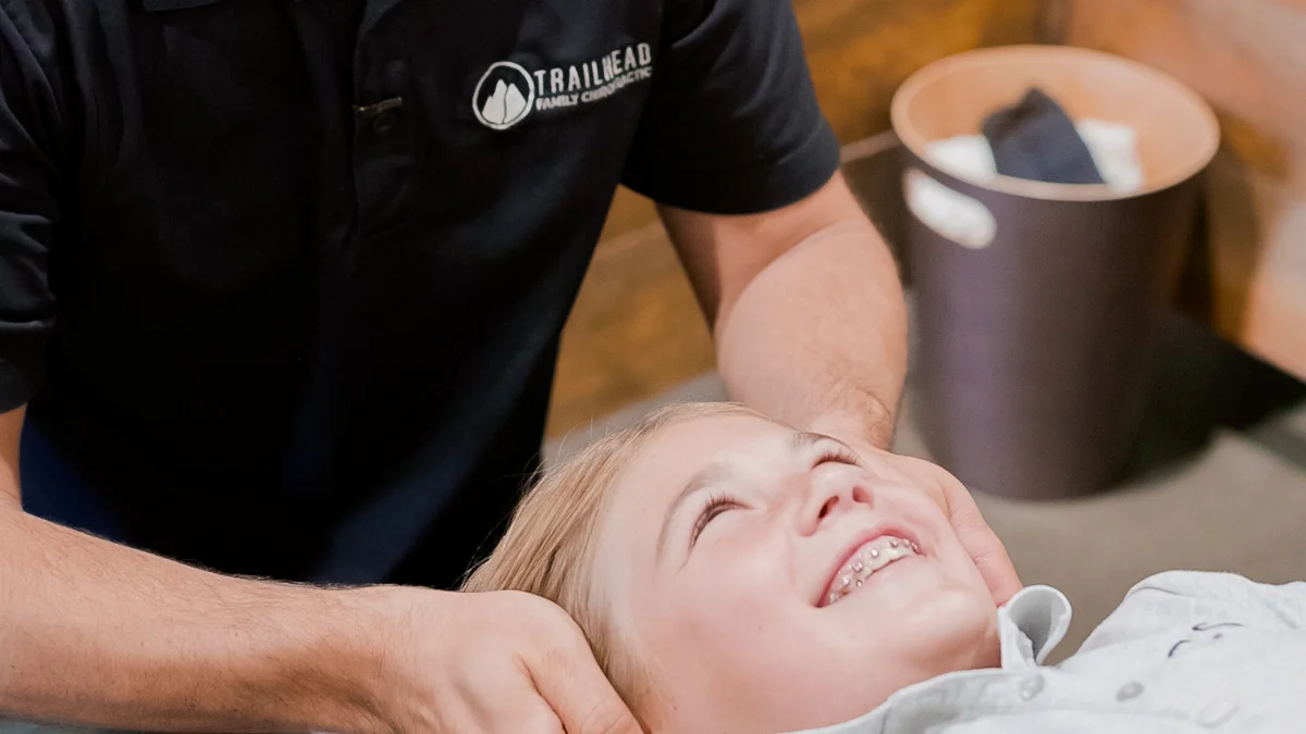 Child smiling during pediatric chiropractic care at Trailhead Family Chiropractic in Temecula